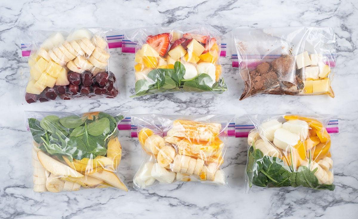 Different fruits and vegetables laid out, ready to be added to a smoothie