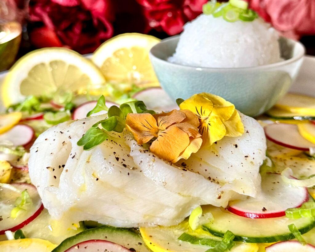 close up of steaming lemon sole fillets in a steamer basket