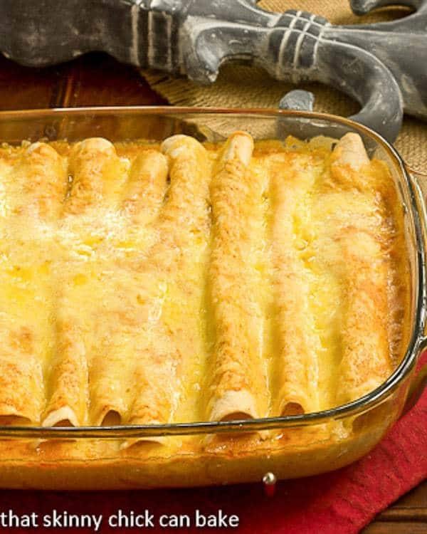 view of the enchilada filling with mac and cheese spilling out from the sides