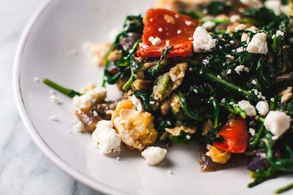 Arugula salad with roasted vegetables, vibrant colors, close-up shot