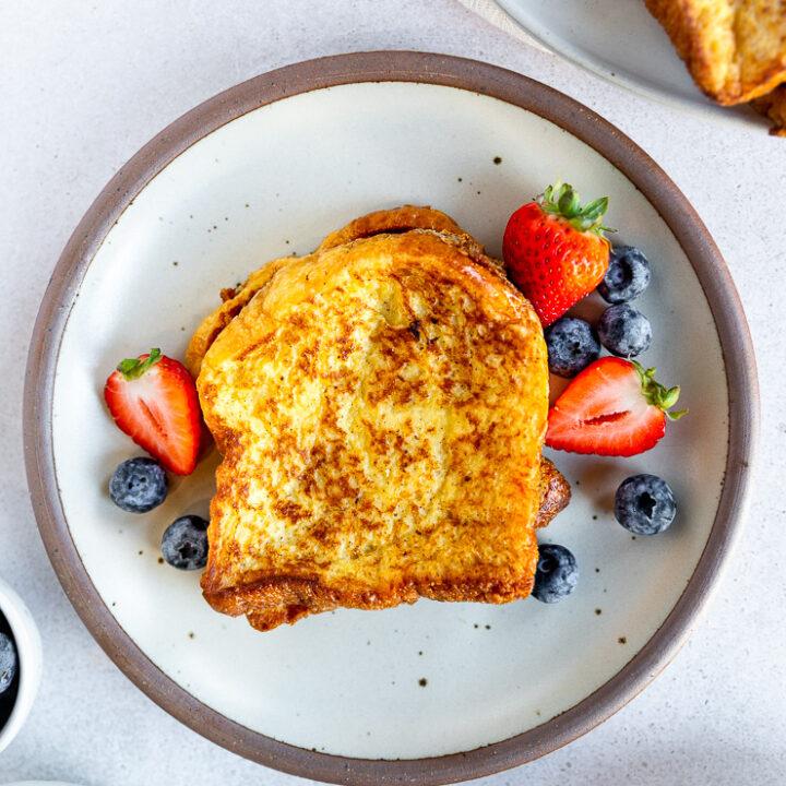 Overhead shot of a table set for breakfast with a plate of brioche French toast