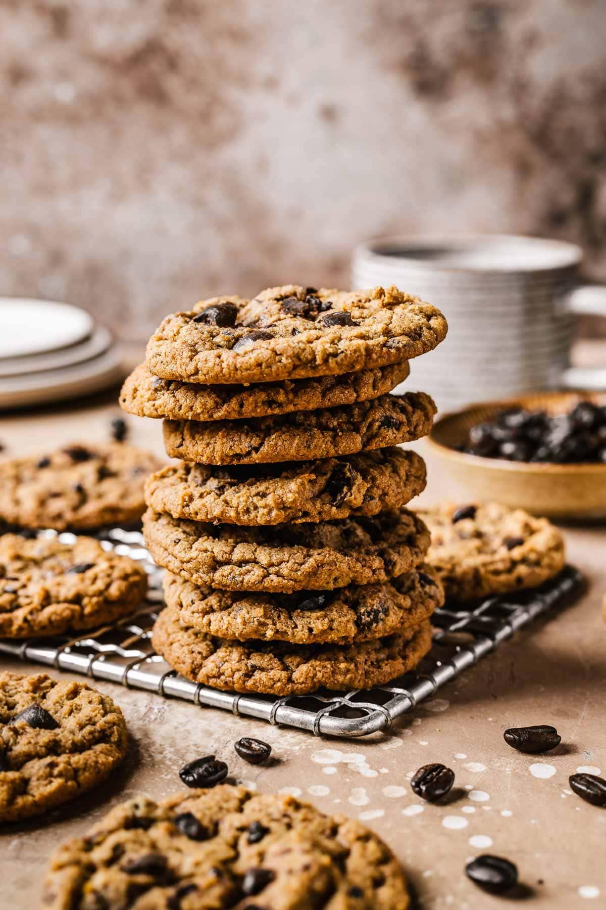 rich dark espresso cocoa cookies on a cooling rack with coffee beans