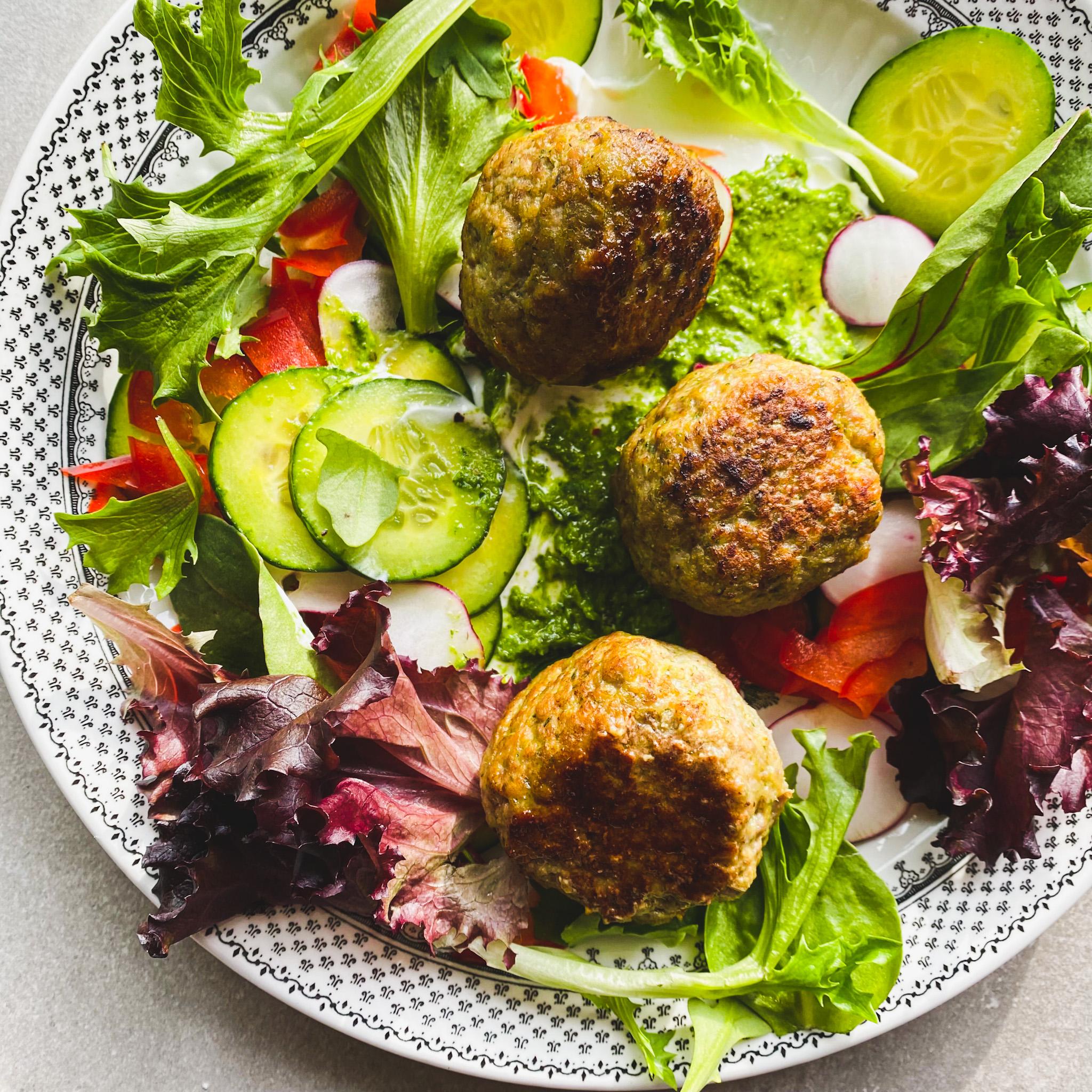 A family enjoying a meal of cumin-spiced turkey meatballs