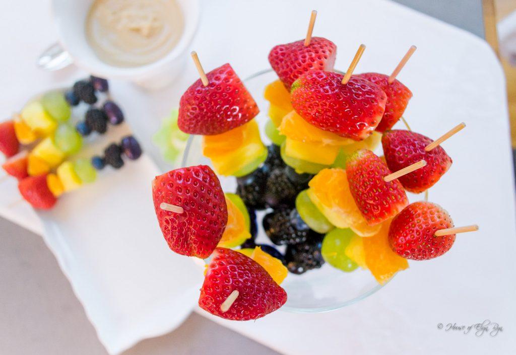 vibrant photo of colorful strawberry fruit kebabs on a picnic table