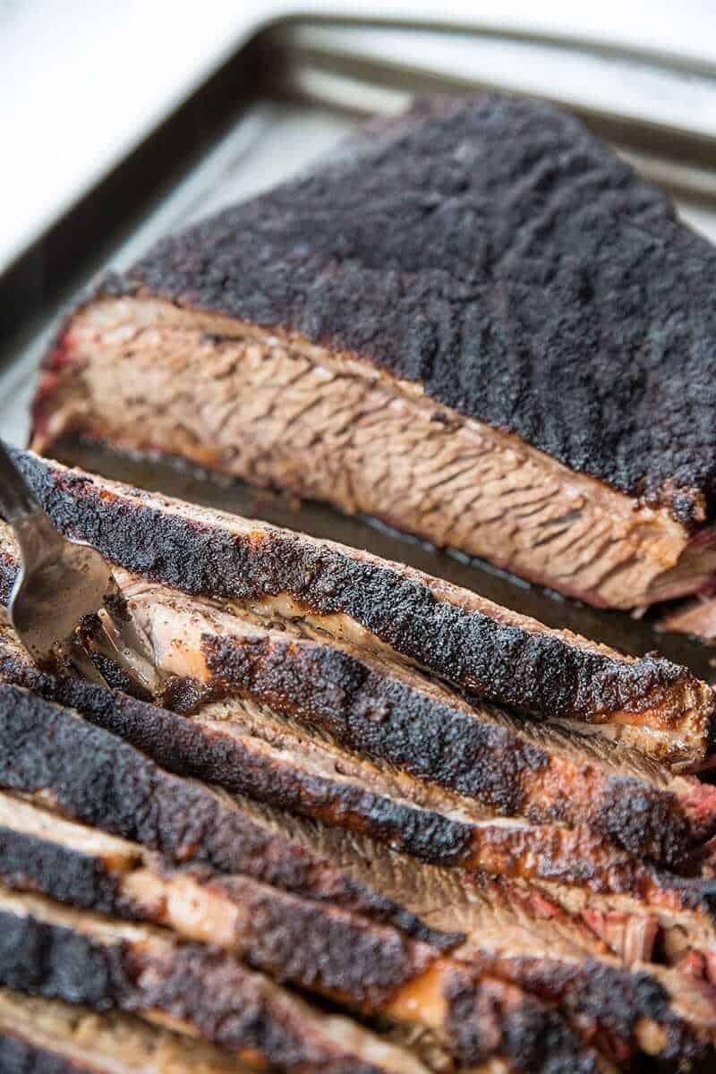 Close-up of raw brisket with dry rub seasoning