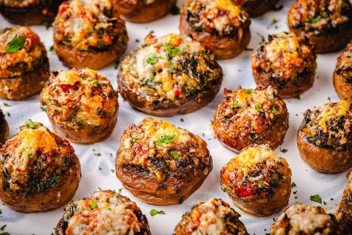 a close-up of freshly stuffed mushrooms ready to be baked