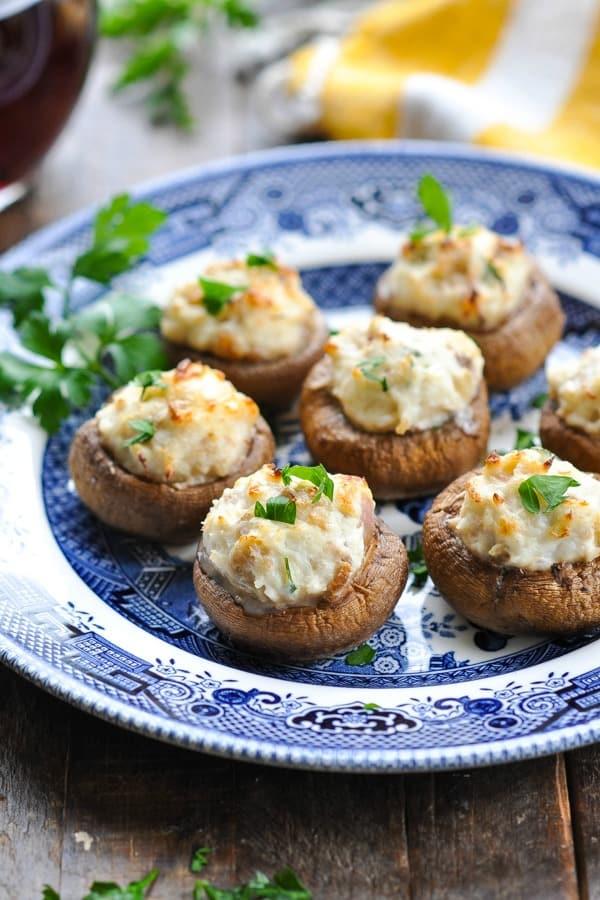 Close-up shot of crab-stuffed mushrooms with garlic and parmesan, garnished with parsley
