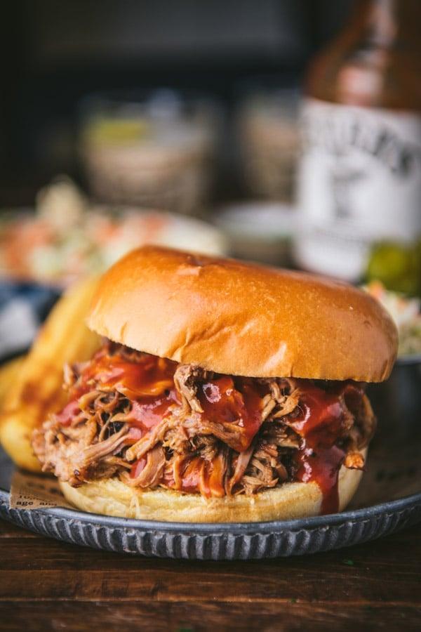 Close-up shot of tender, juicy apricot pulled pork in a slow cooker