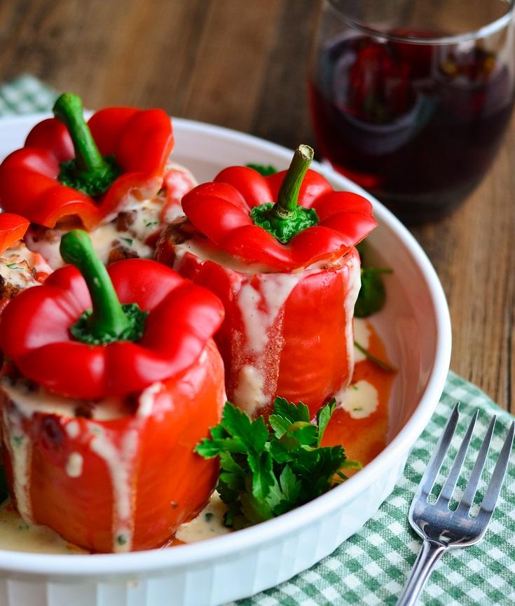 close-up shot of creamy alfredo sauce stuffed peppers