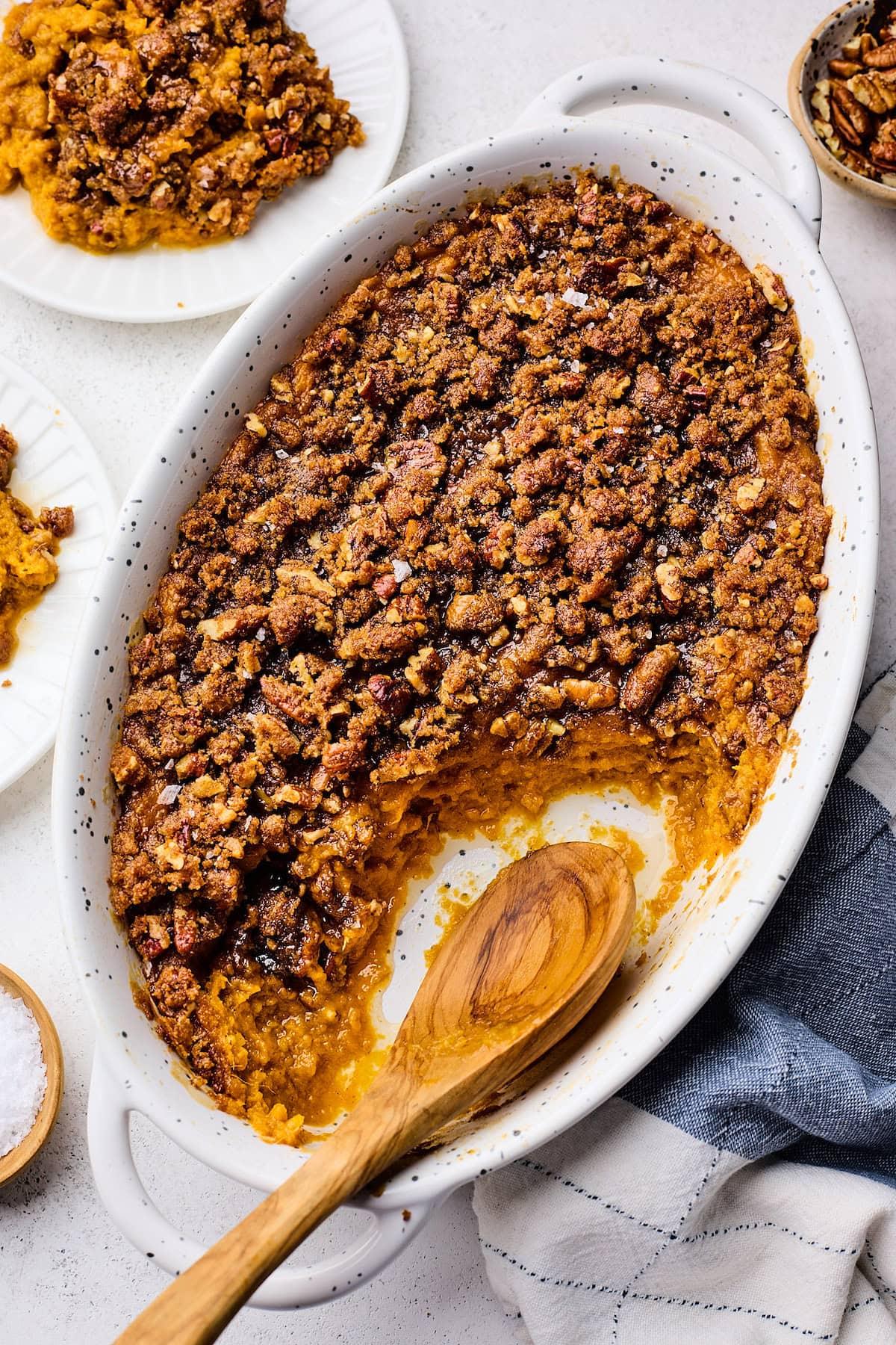 Delicious maple sweet potato casserole with pecan crunch topping, golden brown