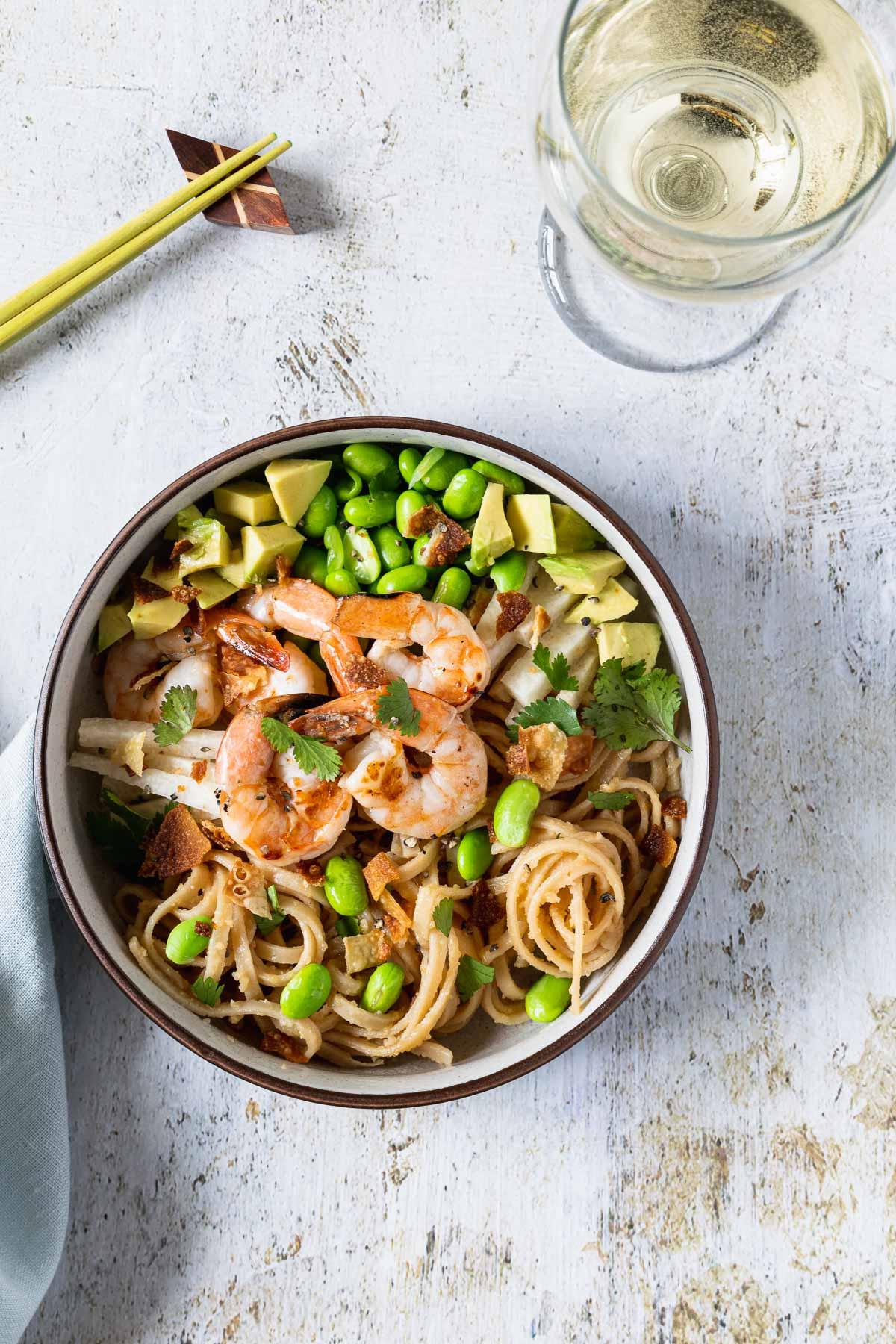 overhead shot of edamame corn udon bowl close-up