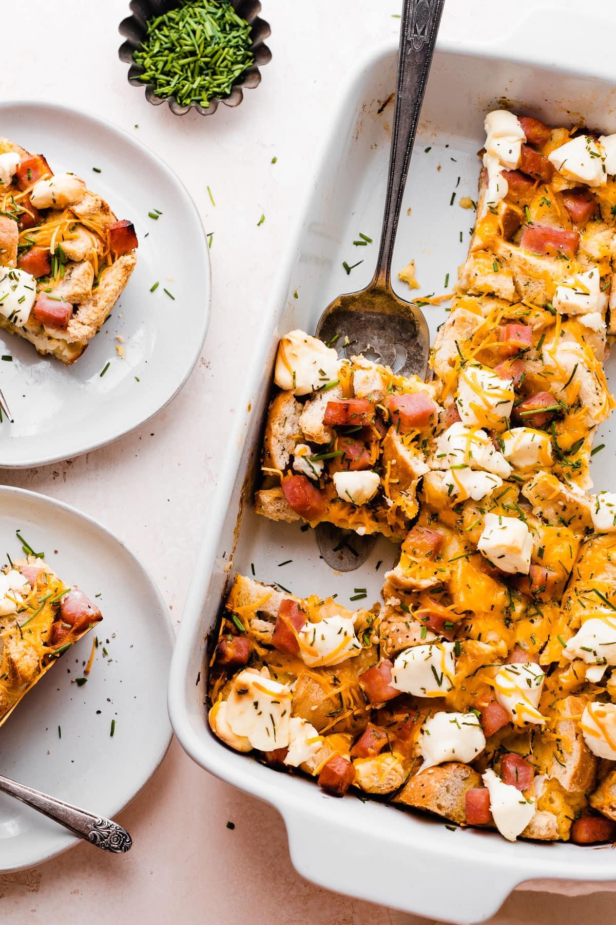 a slice of breakfast bagel casserole being served