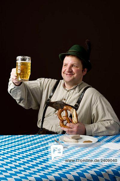 Close-up of someone taking a sip of a Beer-Pretzel Old Fashioned