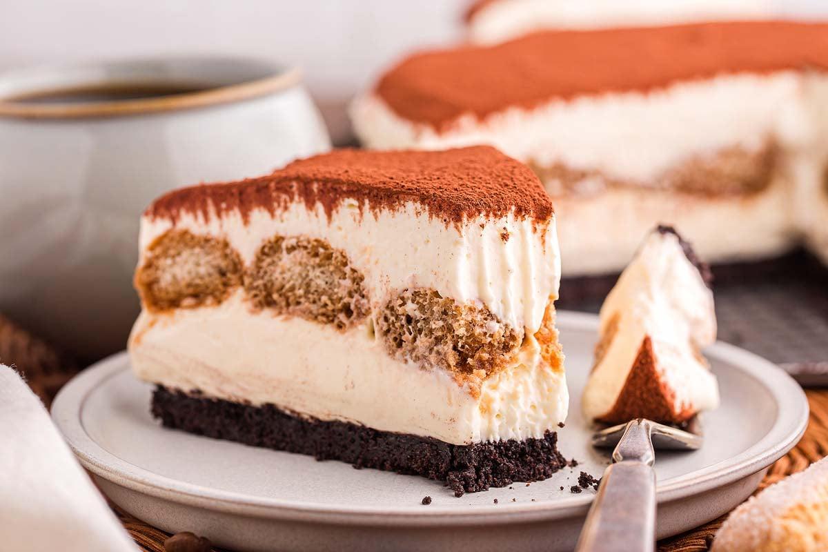 Close-up shot of a slice of Tiramisu Cheesecake with Coffee Crumble, showing its layers and texture