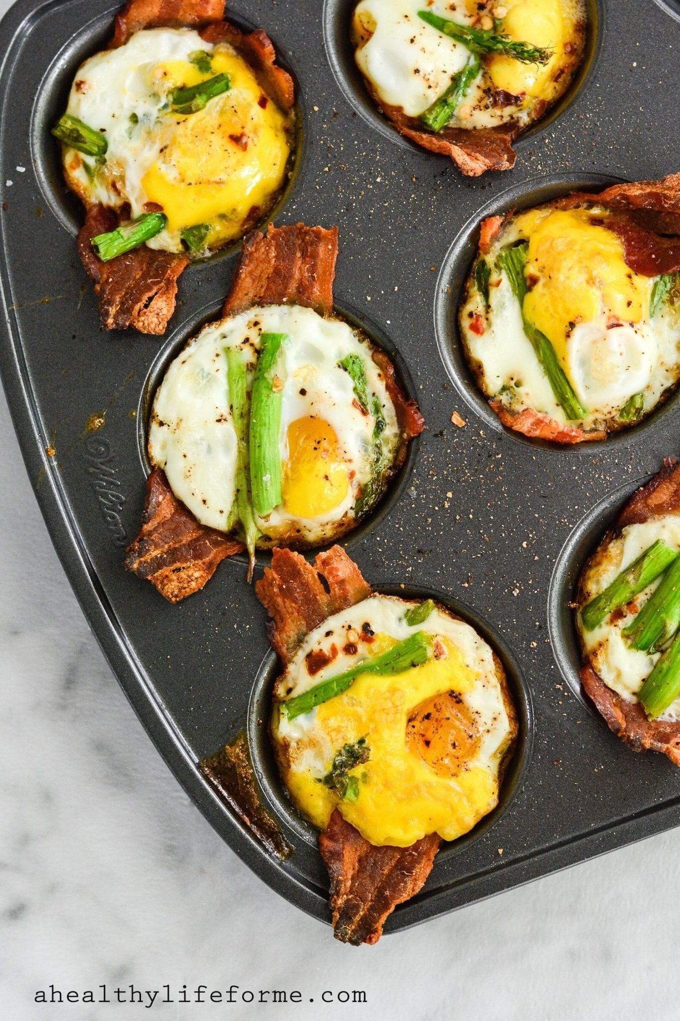 pecan bacon paleo egg muffins on a wooden tray