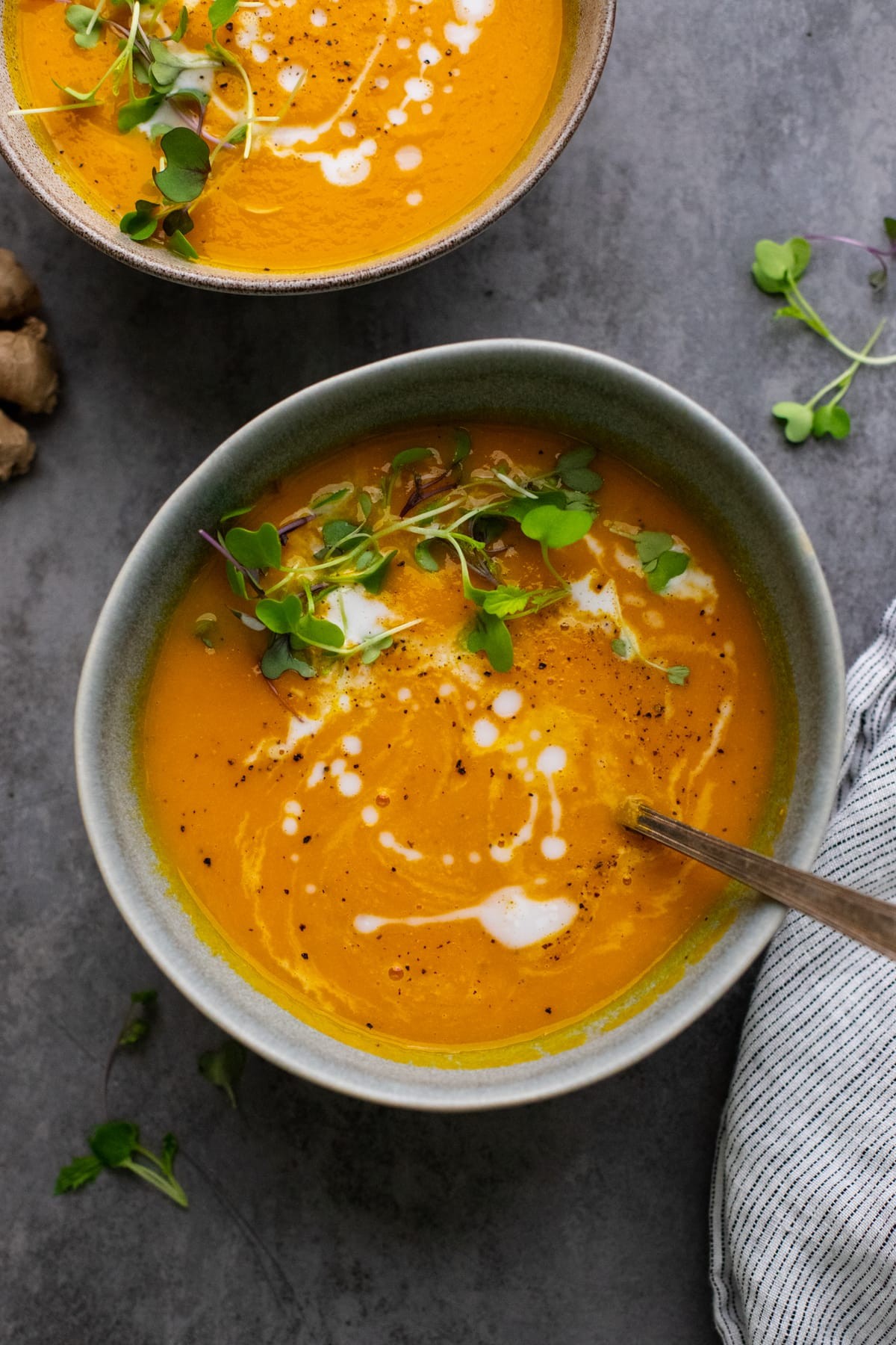 creamy vegan carrot ginger soup in a bowl