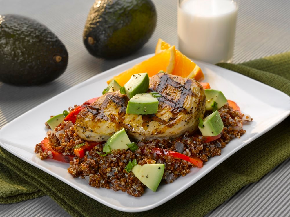 vibrant healthy avocado dinner plate with grilled chicken and fresh vegetables