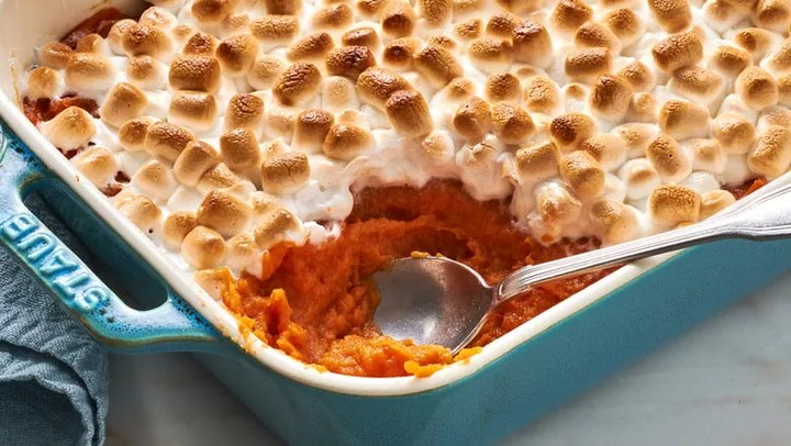 sweet potato casserole with marshmallow topping, close up, golden brown