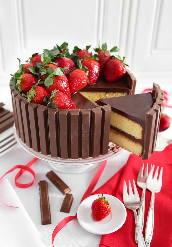 Kit Kat cake with a slice being taken out, showing the layers