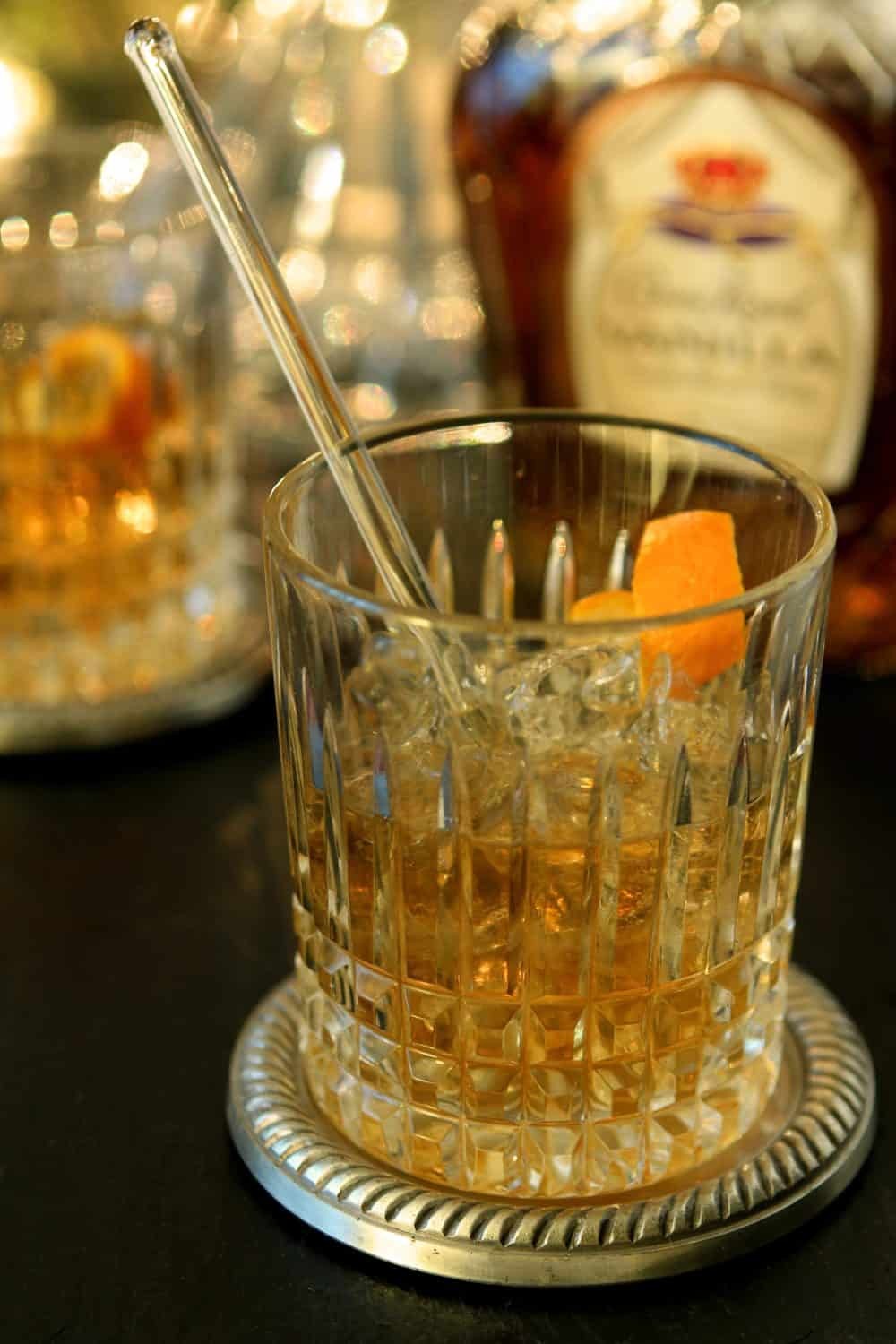 vintage style vodka vanilla cocktail in rocks glass with vanilla bean garnish