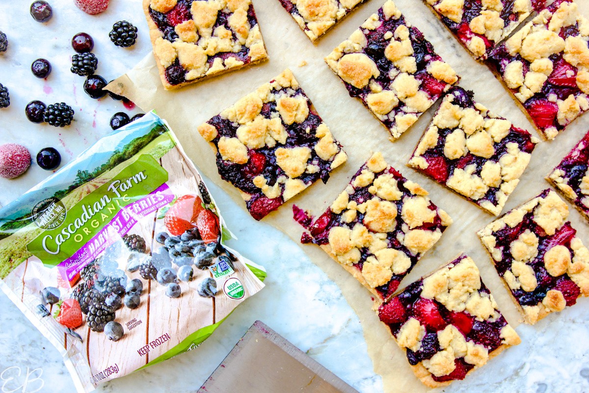 paleo mixed berry bars on a wooden cutting board