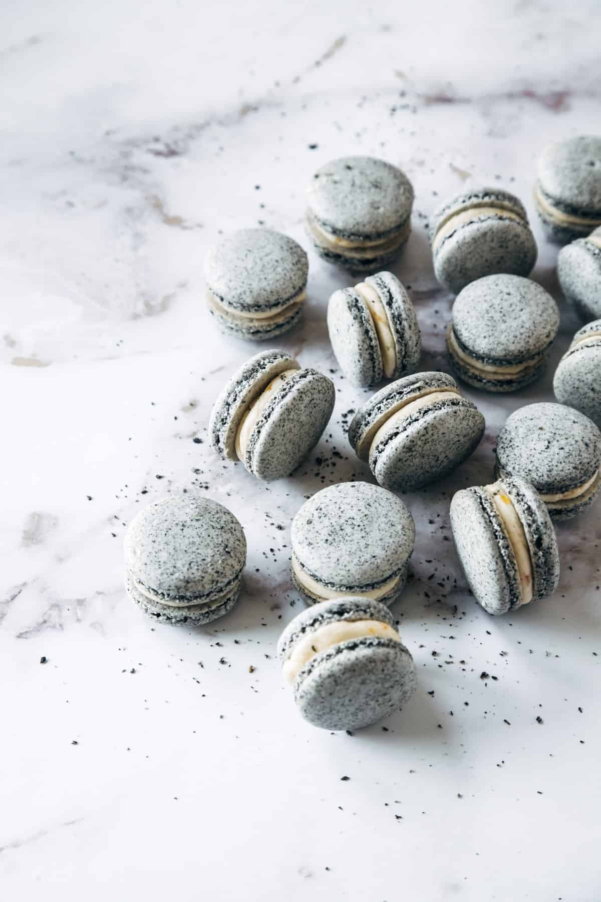 Kimchi macarons with black sesame filling on a white background