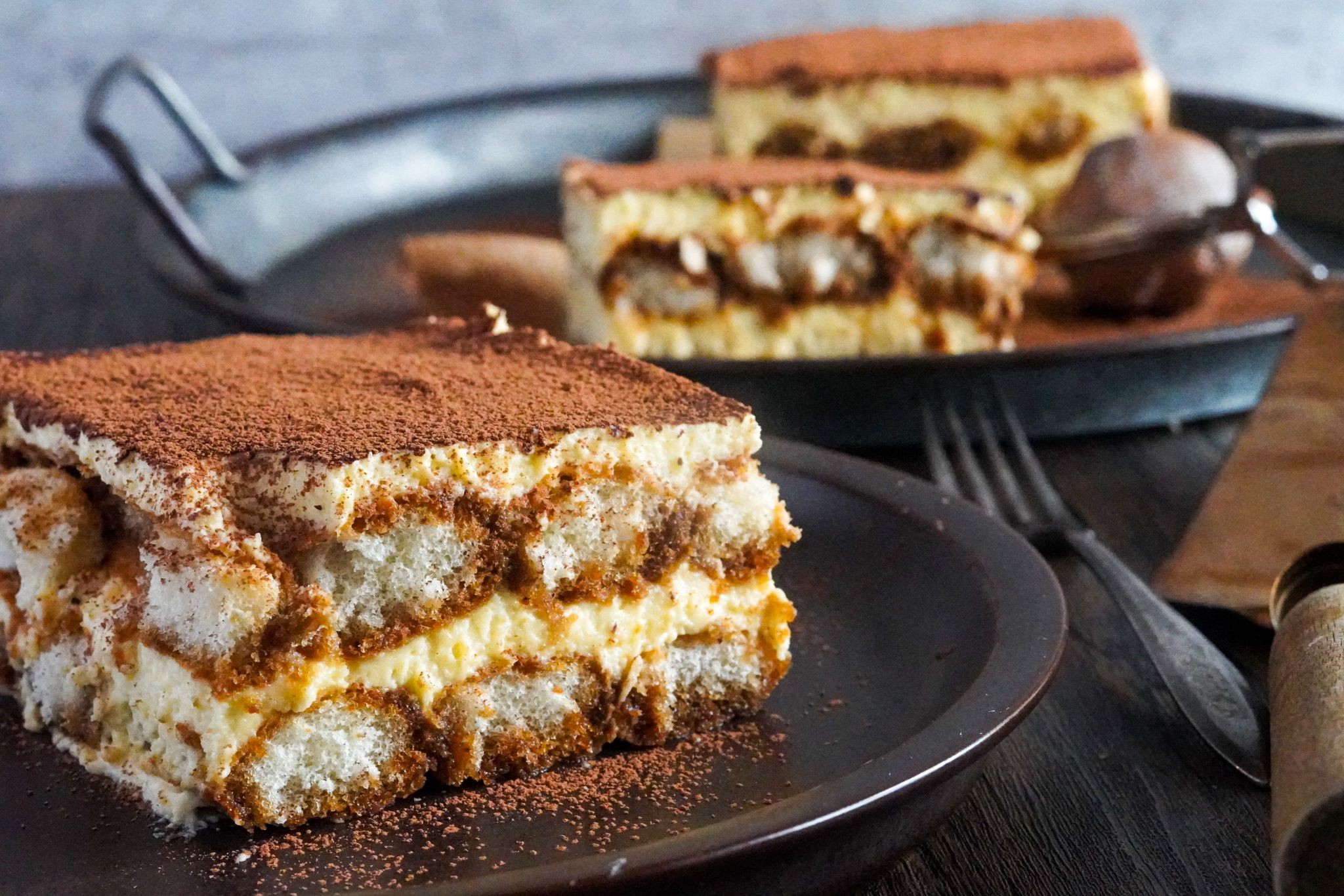 A classic Italian tiramisu dessert with layers of coffee-soaked ladyfingers and creamy mascarpone cheese