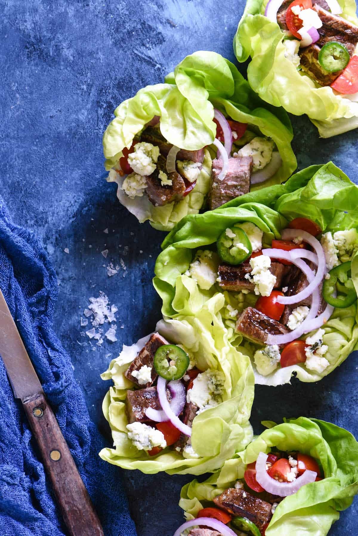 Close-up of juicy steak and blue cheese in lettuce wraps