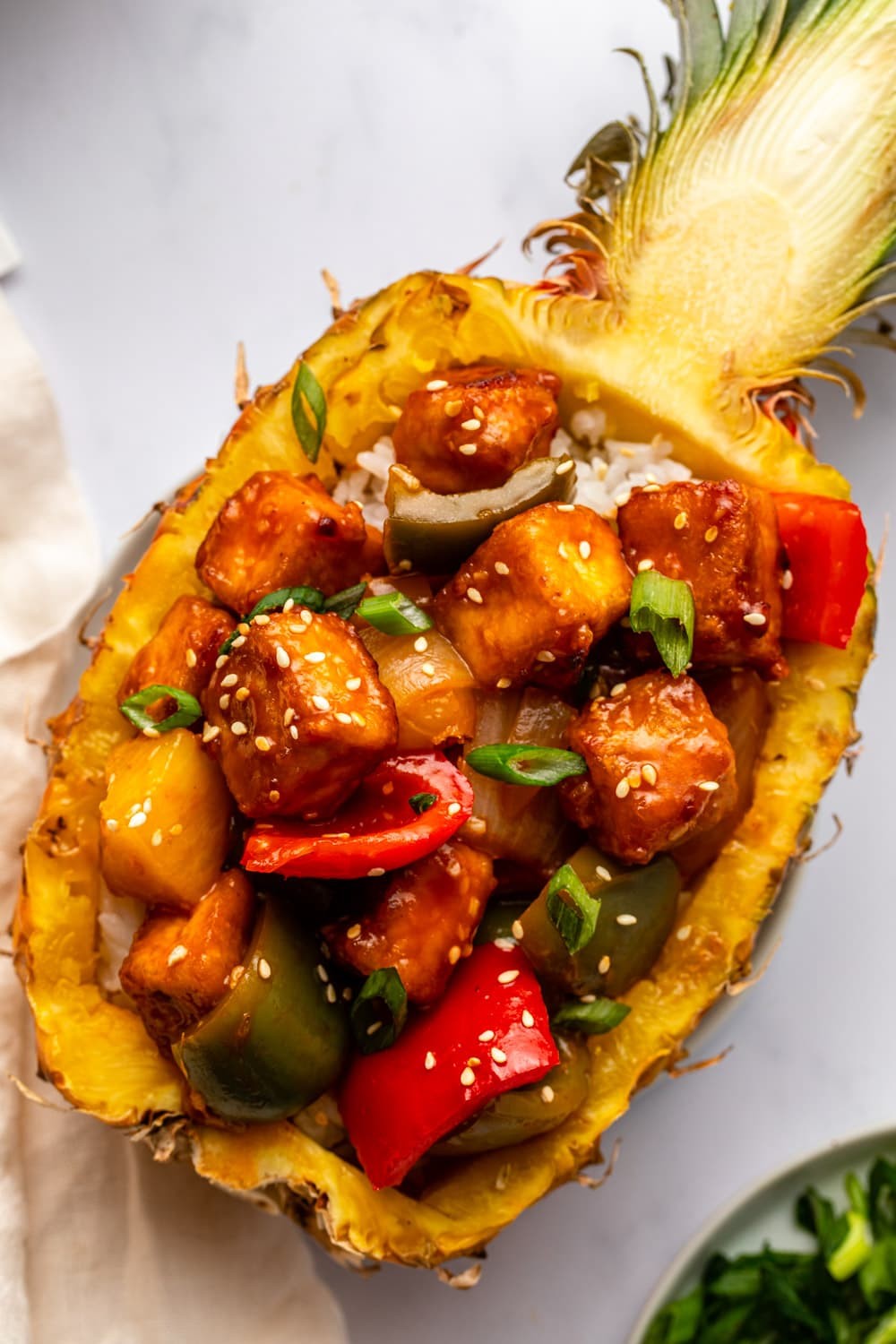 sweet and sour tofu stir-fry with pineapple served in a bowl