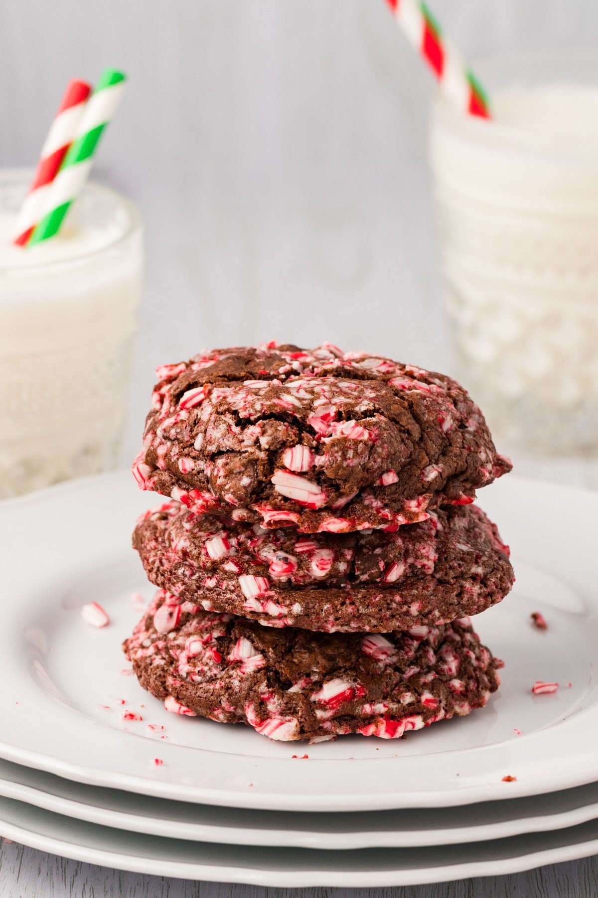 Close-up of cocoa peppermint cookies with crunchy edges on a festive plate, holiday ambiance