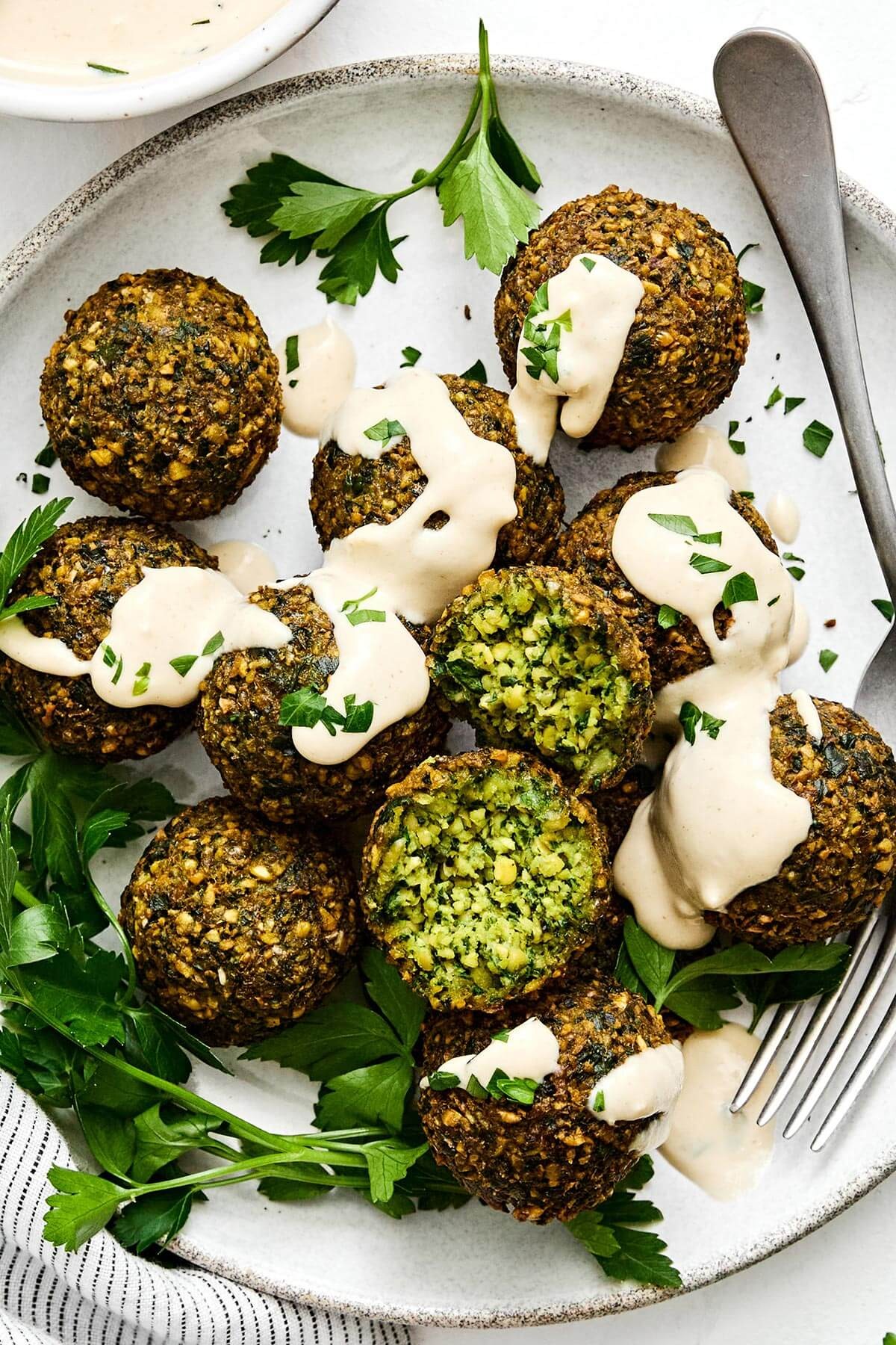 crispy golden falafel balls with vibrant lemon tahini dressing