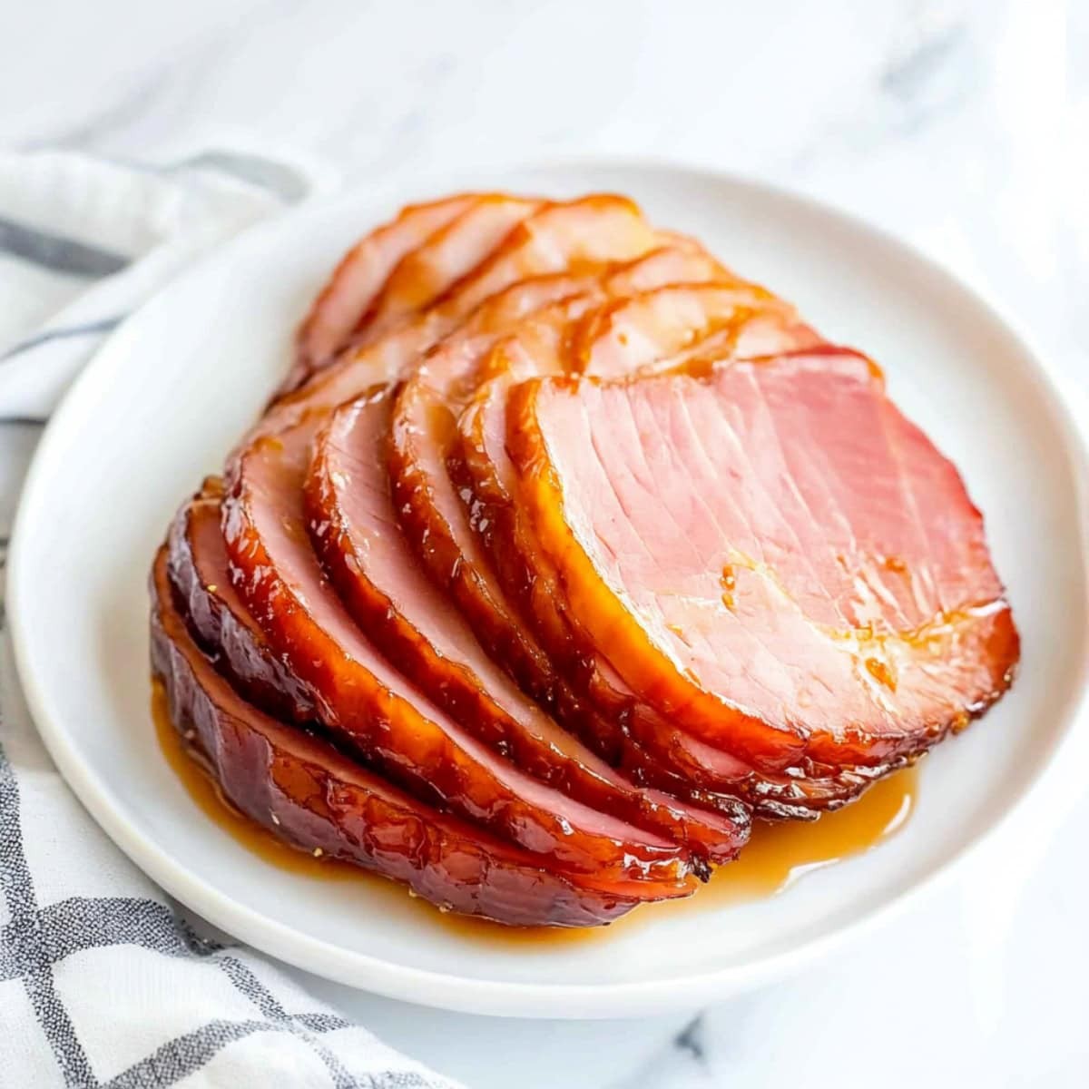 closeup of a glistening, cumin and maple glazed ham