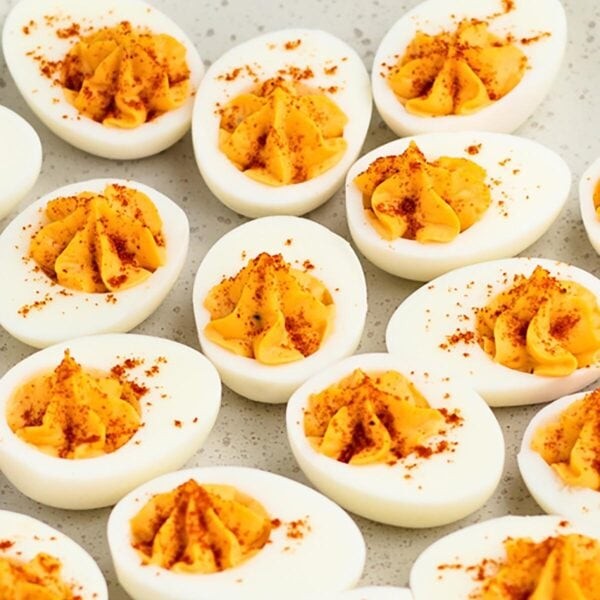 plate of classic deviled eggs with creamy mustard filling