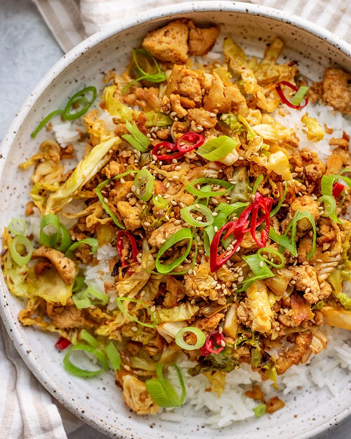 garlic ginger tofu and cabbage stir-fry served in a bowl
