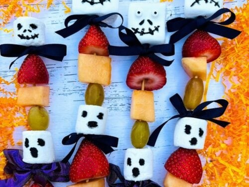Halloween fruit ghosts made with melon and grapes