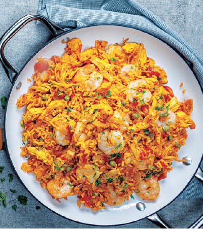 Slow cooker filled with chicken paella