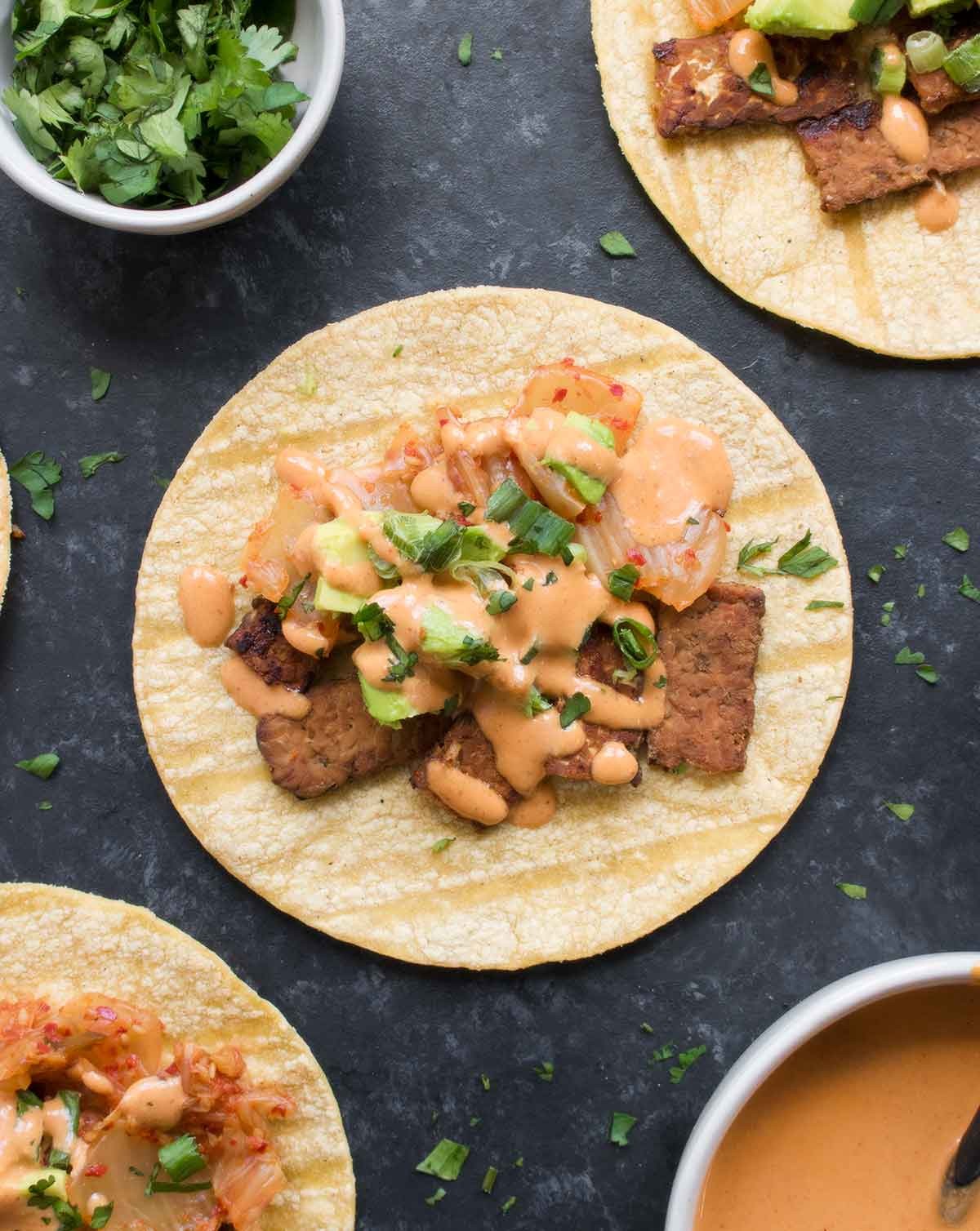 Kimchi Fusion Tacos with Gochujang Aioli, vibrant colors, close-up shot