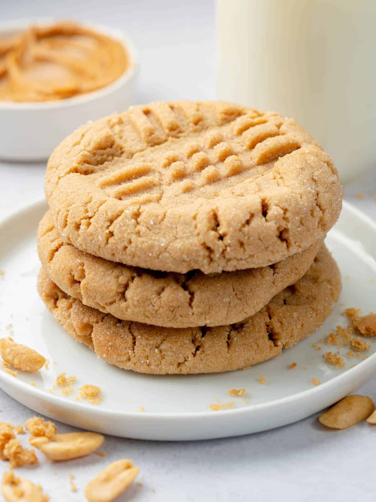 plate of golden brown peanut butter cookies with classic crisscross patterns, warm and inviting