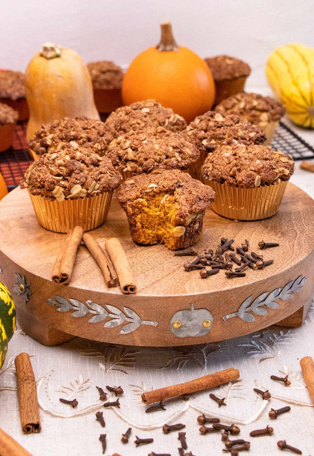 freshly baked pumpkin cinnamon muffins on a wooden board