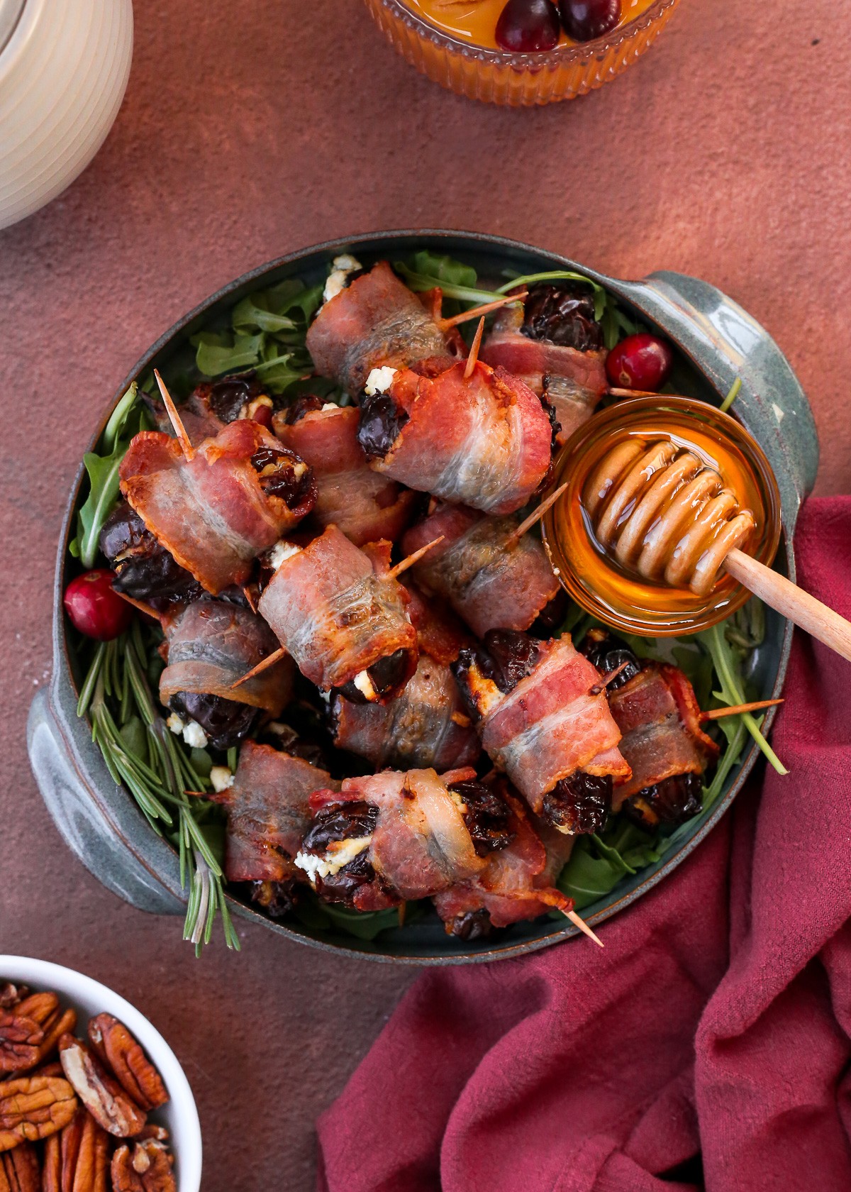 Appetizing platter of sticky bacon-wrapped dates with balsamic drizzle, close-up, golden brown, vibrant