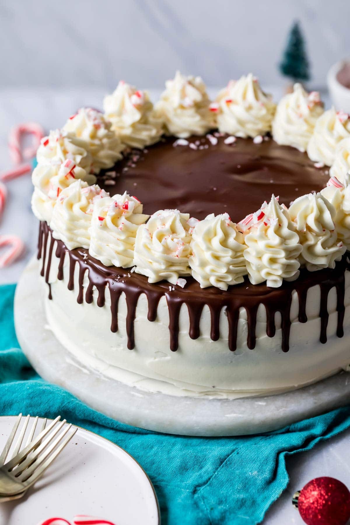 peppermint bark polenta cakes with white chocolate drizzle and crushed peppermint candy
