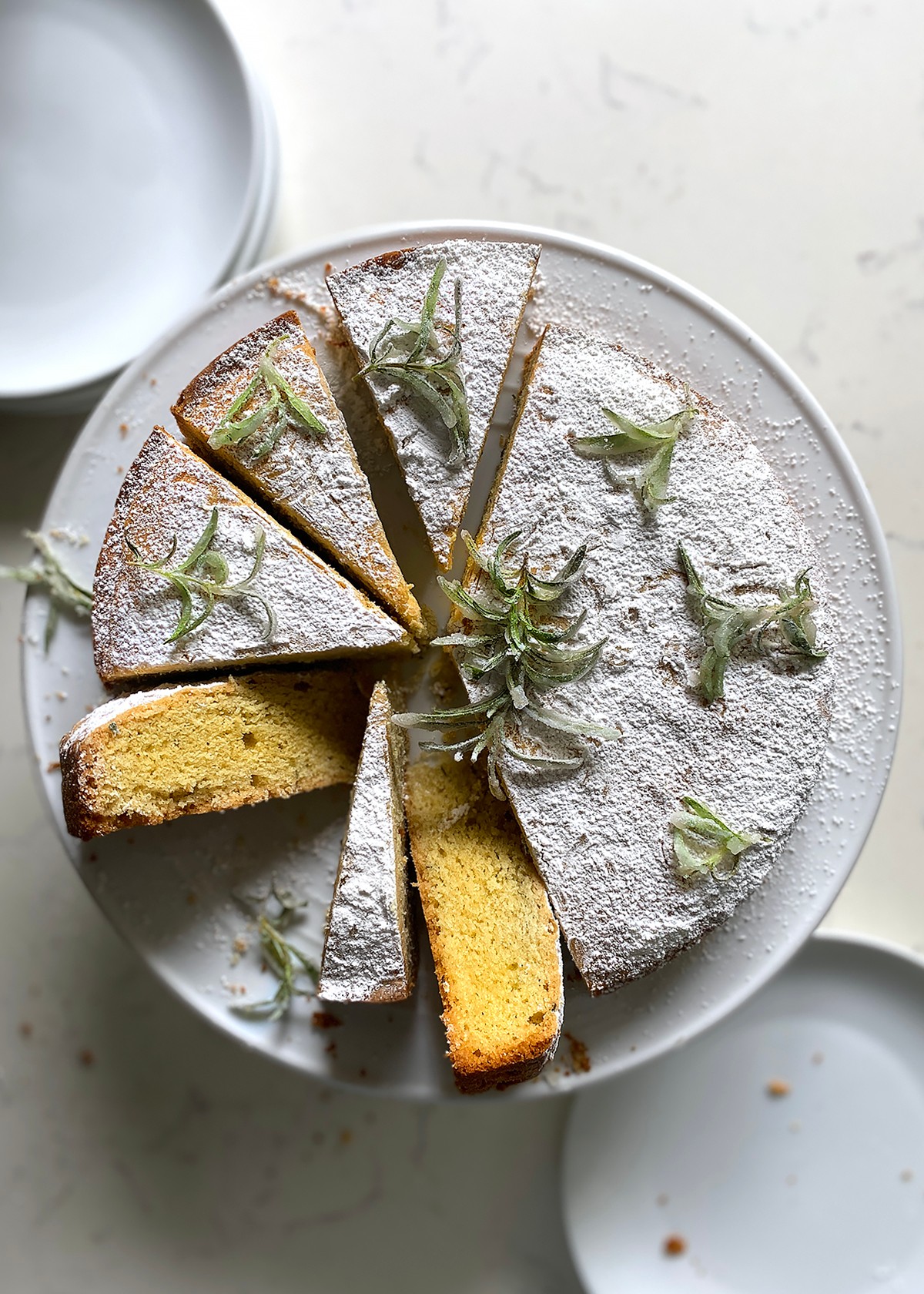 rosemary olive oil cake on a rustic wooden table