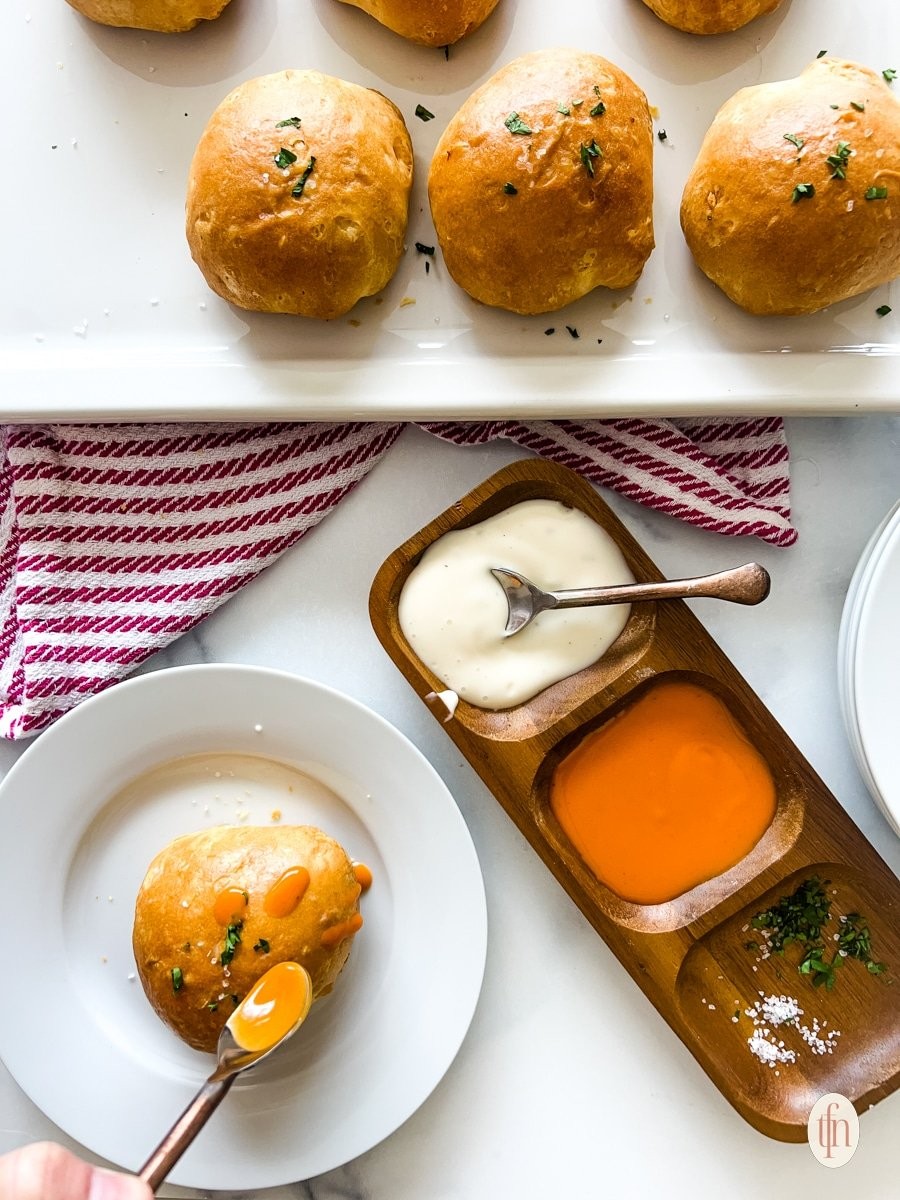 Buffalo Chicken Cheese Bombs on a platter with dipping sauce