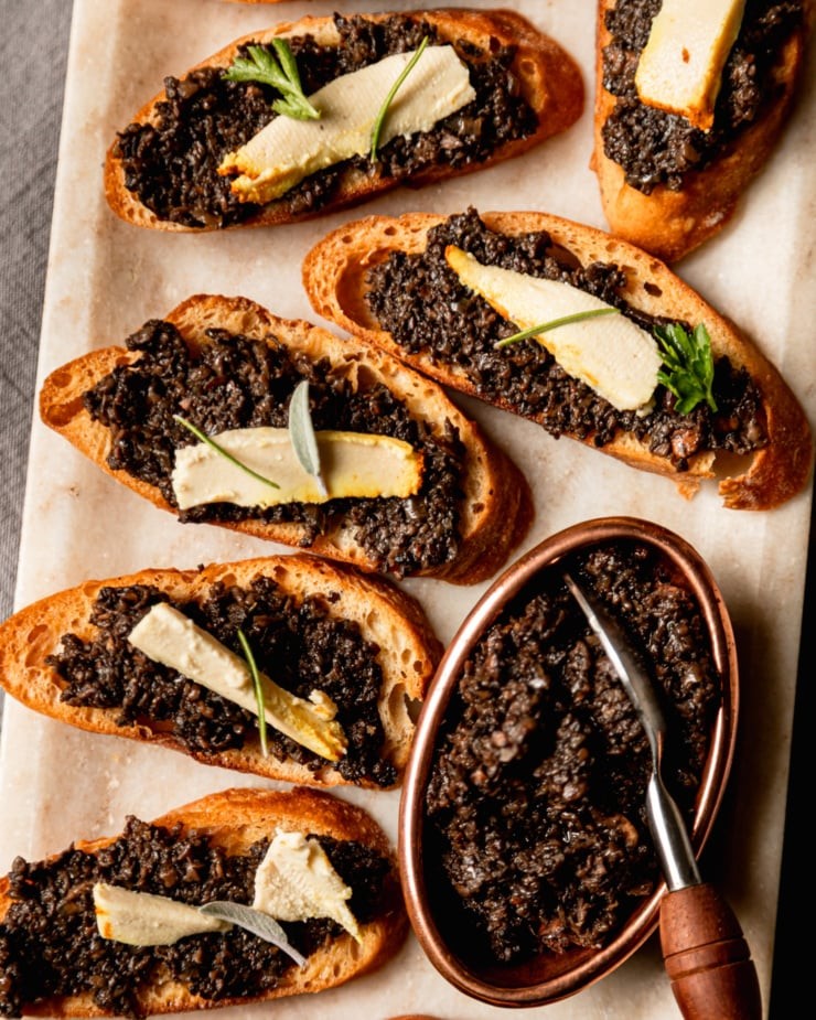 creamy vegan goat cheese with herbs, close up shot