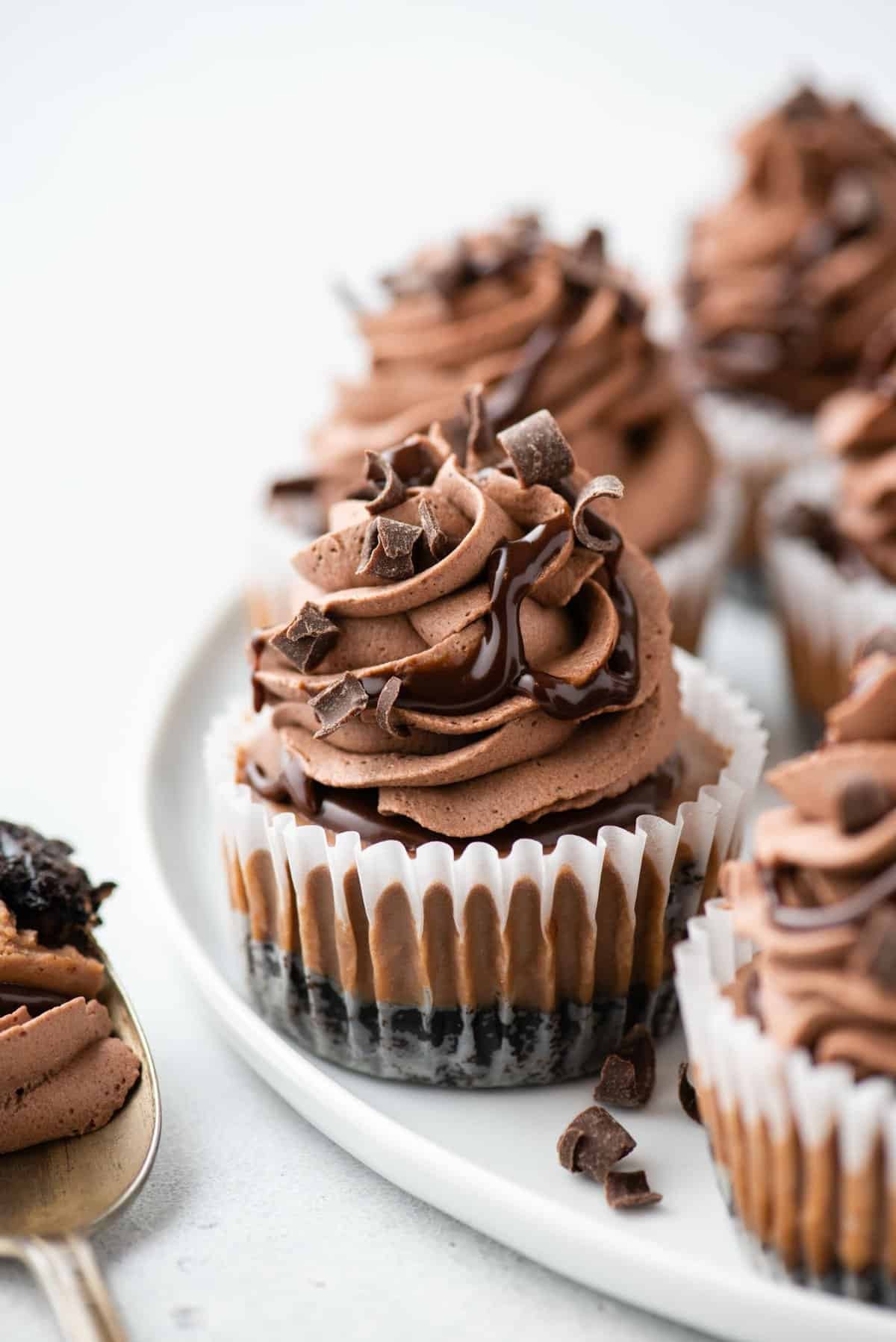 mini champagne cheesecakes with chocolate shavings on a platter