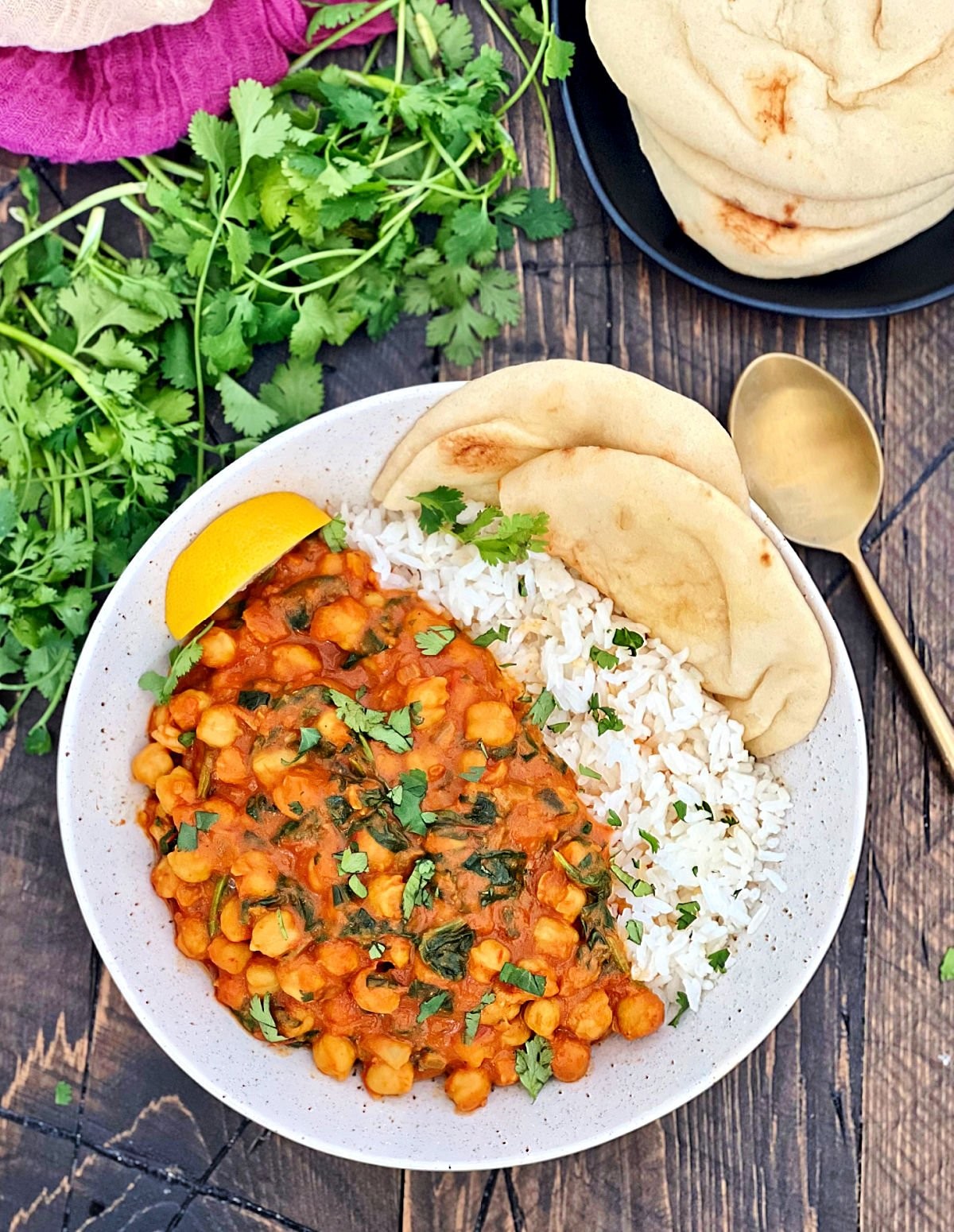 overhead shot of a bowl of homemade chickpea curry with fresh cilantro garnish