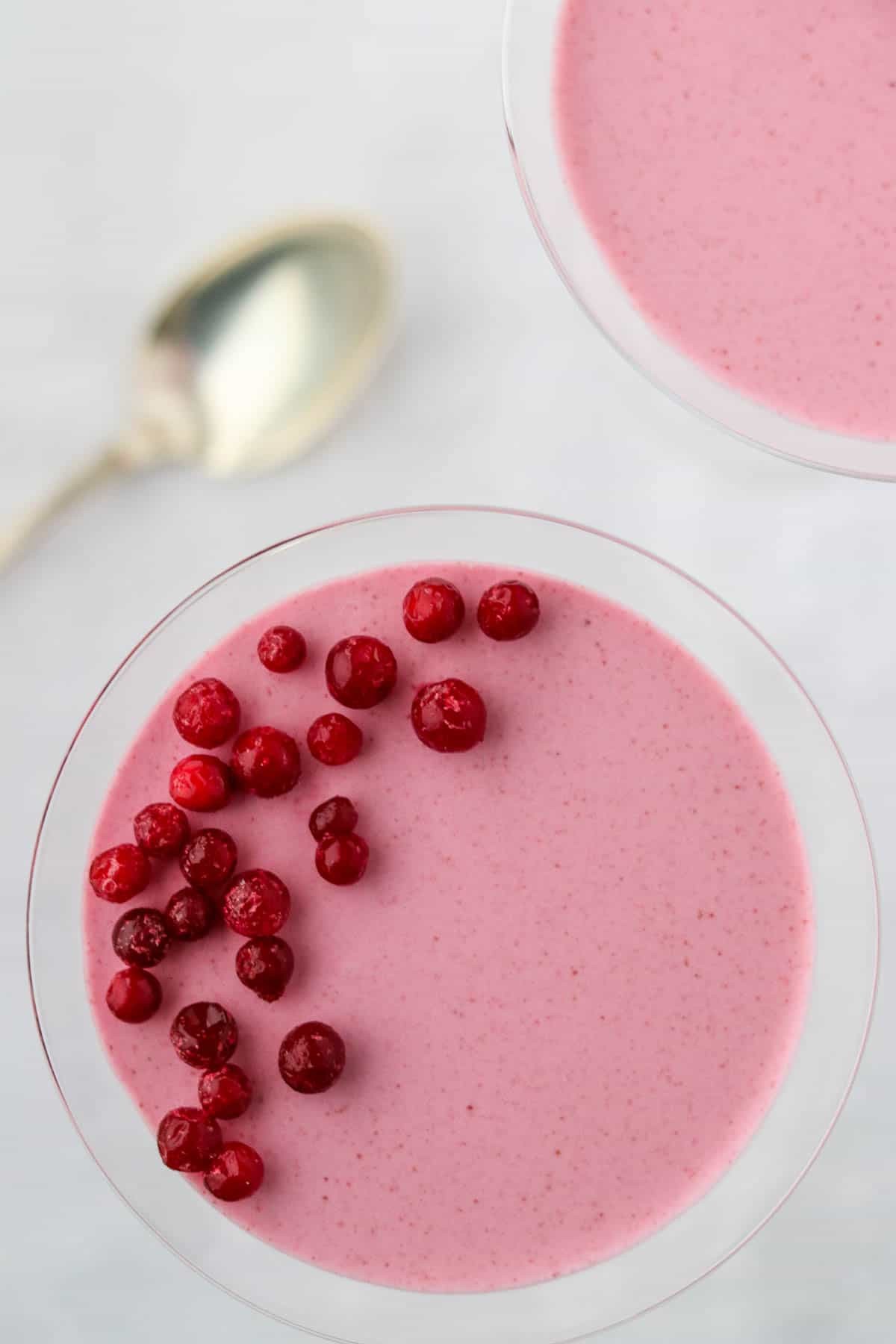 lingonberry mousse cups on a wooden table