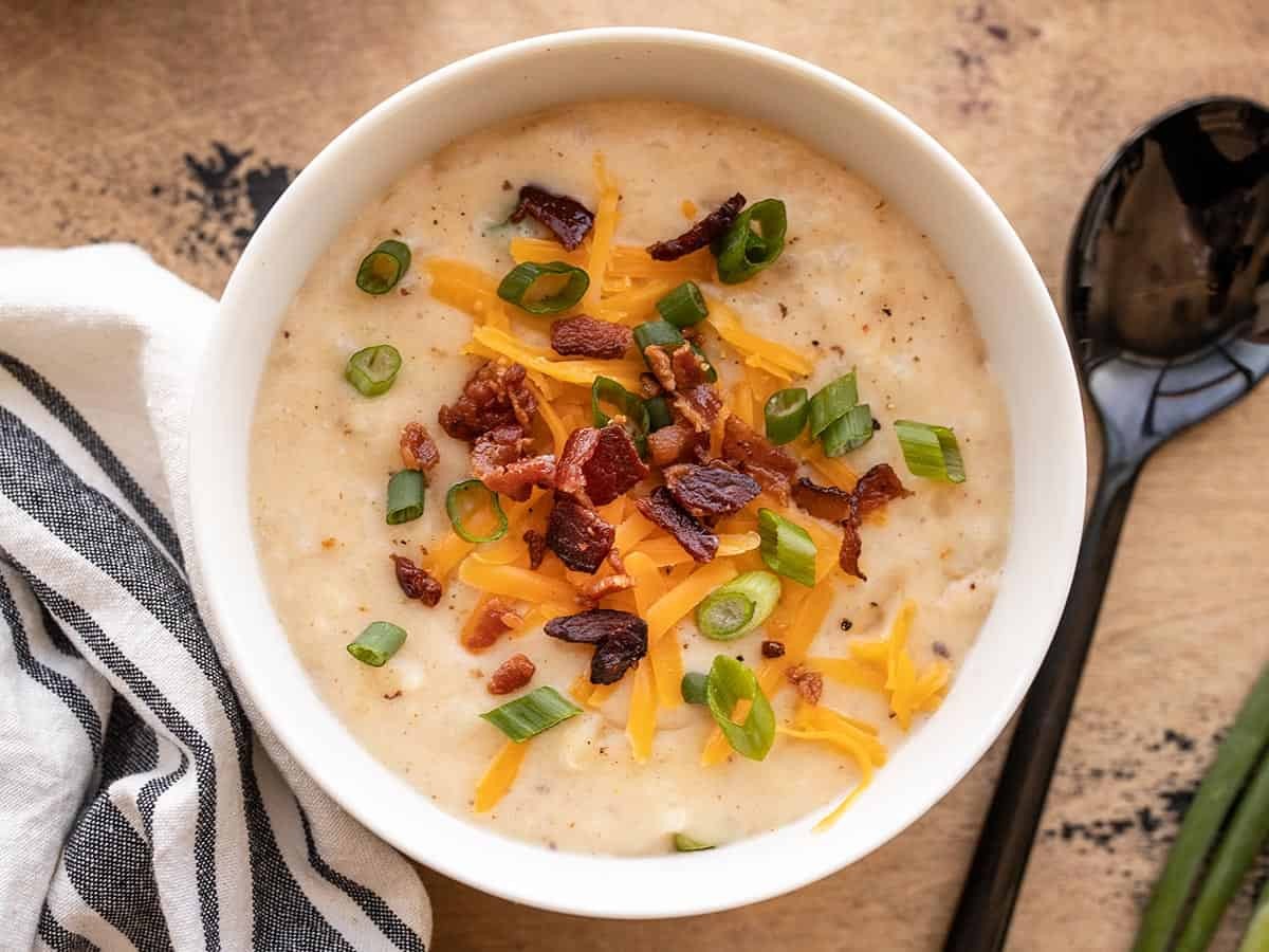bowl of homemade loaded potato soup with toppings
