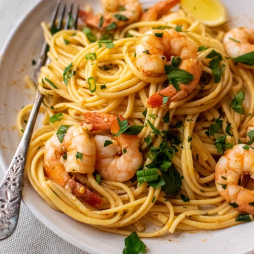 Close-up shot of Shawarma-Spiced Shrimp Scampi with Linguine, highlighting the vibrant colors and textures