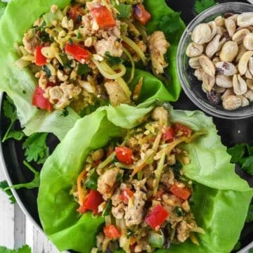 overhead shot of chicken lettuce wraps on a wooden table